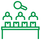 Green line icon showing people inspecting items with magnifying glass, representing product quality control and assurance process.